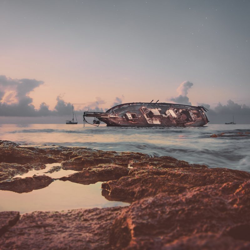 A ship wrecked along a coastline